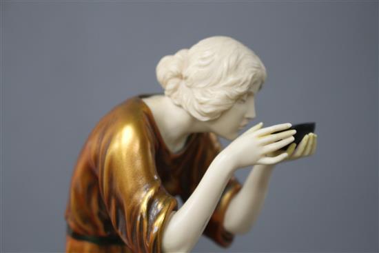 An Art Deco style resin figure of a lady, height 28cm